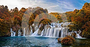 Krka, Croatia - Panoramic view of the famous Krka Waterfalls in Krka National Park on bright autumn morning with colorful foliage