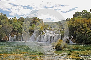 Krka National Park with a beautiful Skradinski Buk waterfall in early autumn, famous travel destination in Dalmatia of Croatia.