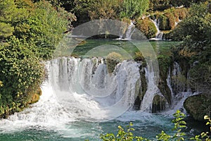 Krka National Park with a beautiful Skradinski Buk waterfall in early autumn, famous travel destination in Dalmatia of Croatia.