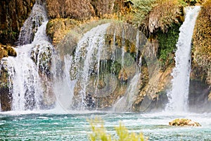 Krka, Sibenik, Croatia - Watrefall spume spraying into a cascade at Krka National Park