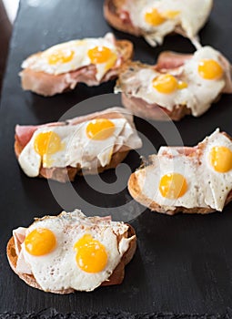 Kroc madam, bruschetta with fried Quail egg and jamon