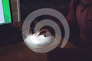 Portable USB Digital Microscope connected to a laptop. Man examines biological tissue