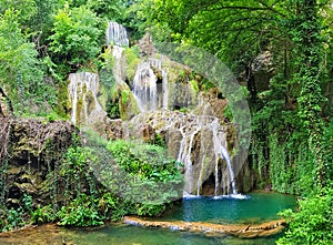 Krushuna waterfalls, Bulgaria - forest and blue water landscape - panorama