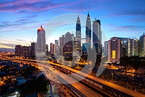 Kuala Lumpur city skyscraper and highway street with nice sky sunrise at downtown business district in Kuala Lumpur. Malaysia.