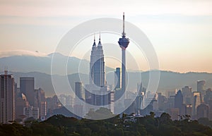 Kuala Lumpur Cityscape at sunrise with KLCC & Menara KL Tower in Kuala Lumpur, Malaysia.