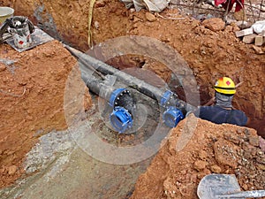 Underground sewerage pipe installed by construction workers at the construction site.