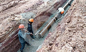 Underground sewerage pipe installed by construction workers at the construction site.