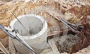 Underground sewerage pipe installed by construction workers at the construction site.