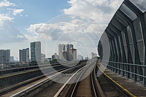 Public train track with view of skyscrappers. Transportation concept. outdoor.