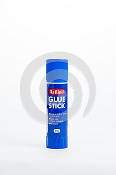 Artline glue stick isolated in white background