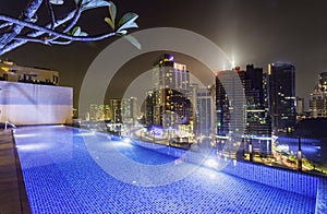 Kuala Lumpur night scene cityscape,and illuminated swimming pool,Kuala Lumpur,Malaysia