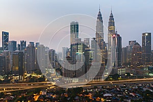 Kuala Lumpur skyline and skyscraper with highway road at night i