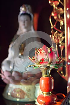 Kuanyin and lotus statue photo