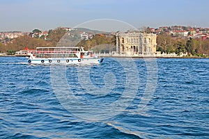 Kucuksu Kasri and touristic boat in Instanbul, Turkey