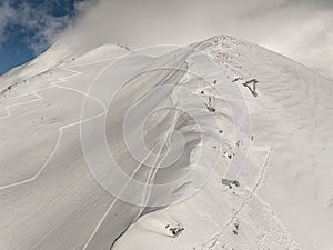 Kudebi, Bidara, Sadzele, Kobi aerial panorama in caucasus winter mountains. Aerial drone view of Gudauri ski resort in winter.