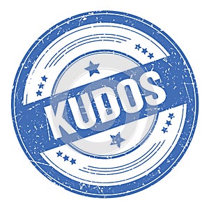 KUDOS text on blue round grungy stamp