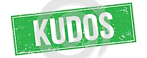 KUDOS text on green grungy rectangle stamp