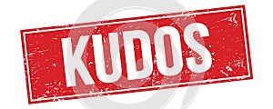 KUDOS text on red grungy rectangle stamp