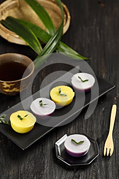 Kue Talam or Kue Nona Manis, Indonesian Traditional Cake Mde from Rice FLour and Coconut Milk, Steamed in a Plastic Cup