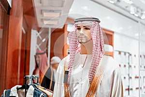 kufiya - traditional Arabic headdress on a mannequin in an Oriental fashion and clothing store in Dubai