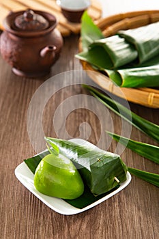 Kuih Koci, traditional Malaysian Nyonya sweet cake. Made from glutinous rice flour with coconut filling, wrapped in banana leaves