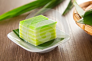 Kuih lapis is a traditional Malay nyonya sweet desert on wooden table