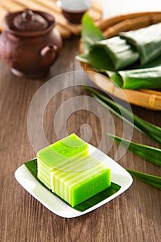 Kuih lapis is a traditional Malay nyonya sweet desert on wooden table