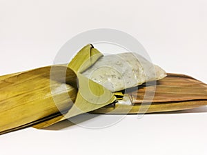 Kuih lepat pisang or also known as Steam banana isolated on white background