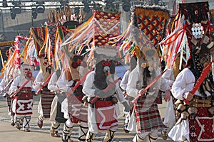 Kukeri, mummers perform rituals to scare away evil spirits during the international festival of masquerade games â€Survaâ€