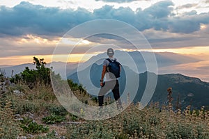 Kula - Hiker man with scenic view from top of mount Kula near Omis, Dinara mountains, Split-Dalmatia, Croatia, Europe