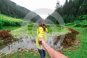 Kullu, Himachal Pradesh, India - September 02, 2018 : Grass covered punrik rishi lake surrounded by deodar tree