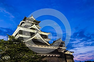 Kumamoto Castle at night in Kumamoto, Kyushu, Japan.