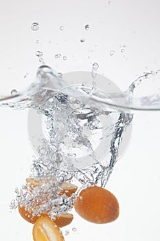 Kumquat dropped into the water