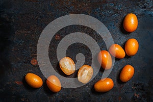 Kumquat fruits on a dark vinta background