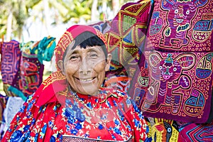 Kuna woman, Panama with traditional art works - Molas,