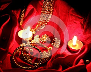 Kundan jewelry in red background in candle light photo