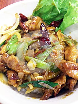 Kung Pao Chicken Chinese Food in a white serving dish.