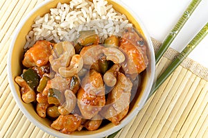 Kung Pao chicken with rice and chopsticks photo