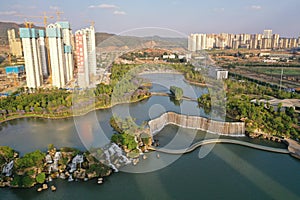 Kunming, China â€“ May 17 ,2019: Aerial view of the Kunming Waterfall Park at sunset, one of the largest manamde waterfalls in the