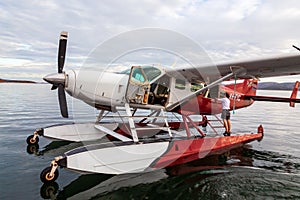 Kununurra, WA. Australia - May 18, 2013: A Cessna 208 Caravan Amphibious Float plane lands on the still waters of Lake Argyle