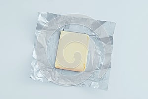 Kuok butter  open foil. White background