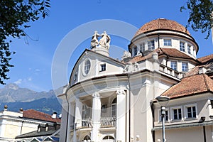 Kurhaus of Merano at promenade and mountain alps panorama in South Tyrol photo