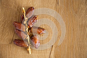 Kurma or dates on wooden background