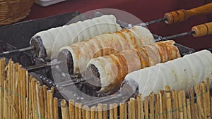 Kurtos Kalacs is traditional hungarian cake baked of yeast dough strip wrapped cone rolled in granulated sugar