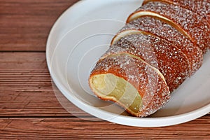 \'Kurtoskalacs\', a spit cake with sugar from Hungary and Romania made from sweet yeast dough strips