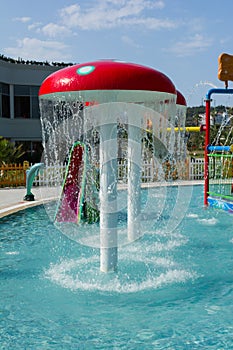 KUSADASI, TURKEY - AUGUST 21, 2017: Colourful plastic slides in aquapark. Children water playground