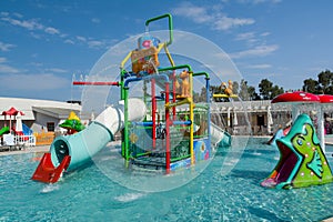 KUSADASI, TURKEY - AUGUST 21, 2017: Colourful plastic slides in aquapark. Children water playground