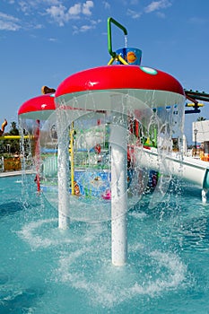 KUSADASI, TURKEY - AUGUST 21, 2017: Colourful plastic slides in aquapark. Children water playground