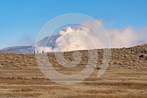 Kusasenri prairie in January, fuming Mt. Naka in the background