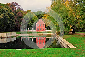 Kuskovo park in Moscow. Dutch house. Autumn nature and pond.